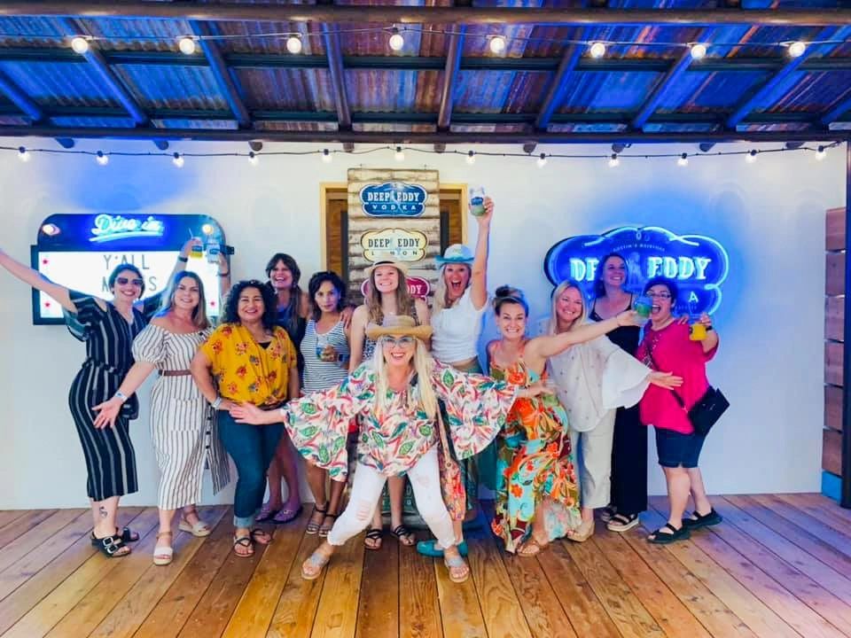 Group of women on a bachelorette party bus tour at Deep Eddy in Austin, TX